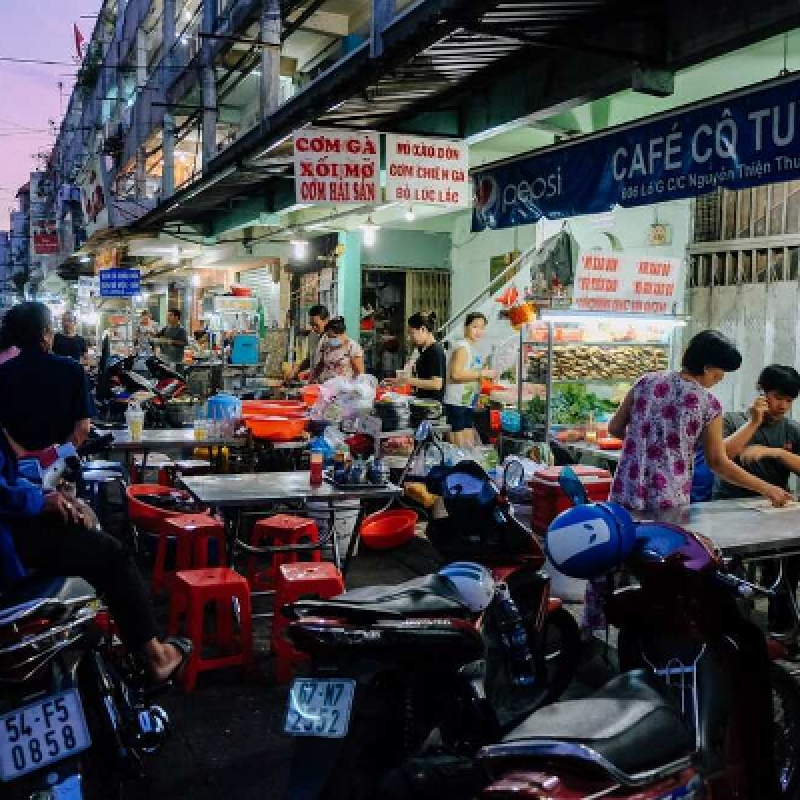 Explore Saigon's Best Street Food and Culture Private Motorbike Night Tour