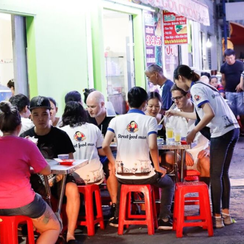 Explore Saigon's Best Street Food and Culture Private Motorbike Night Tour