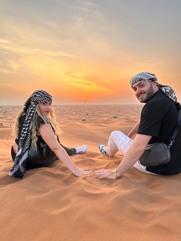 Evening Desert Safari with Camel Ride Sandboard & BBQ Dinner