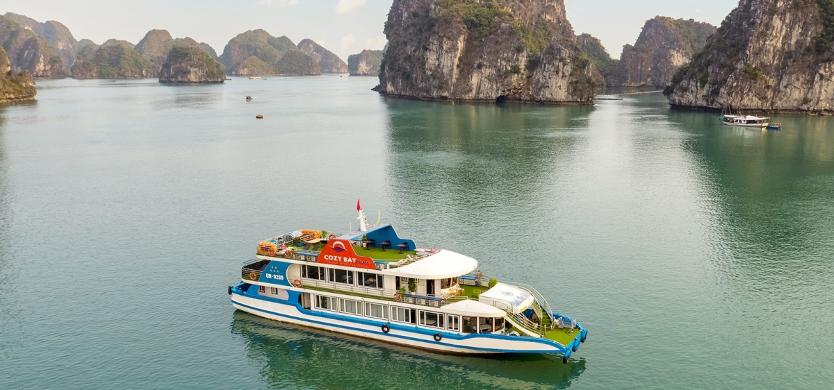 Cozy Bay Premium Cruise – Luxury 6-Hour Halong Bay Day Trip by Sanna Tour